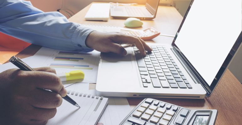 Employee sitting at a laptop working