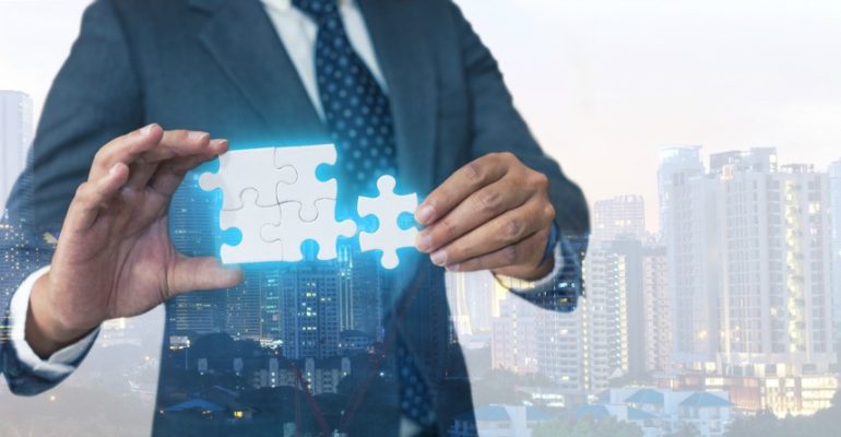 Man who is Putting the Puzzle Pieces Together