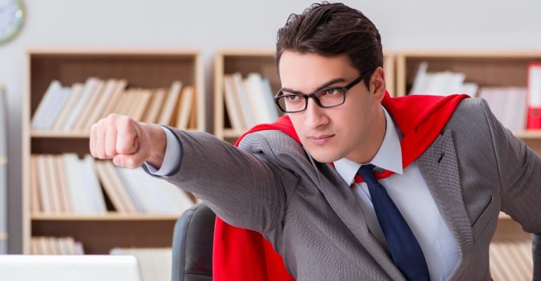 Businessman in cape saves the day