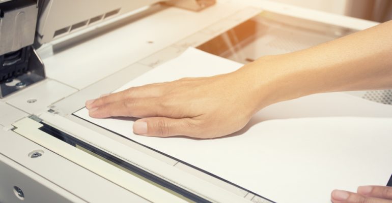 woman hands on paper, scanning