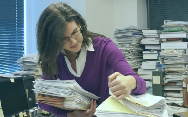 woman sifting through papers