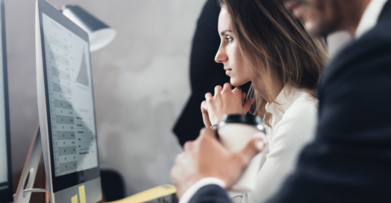 woman looking at computer screen
