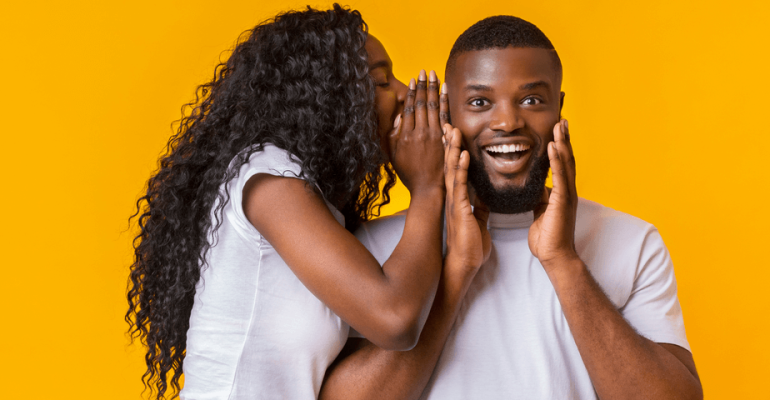 Woman Sharing Secret With Man, guy is excited, yellow background