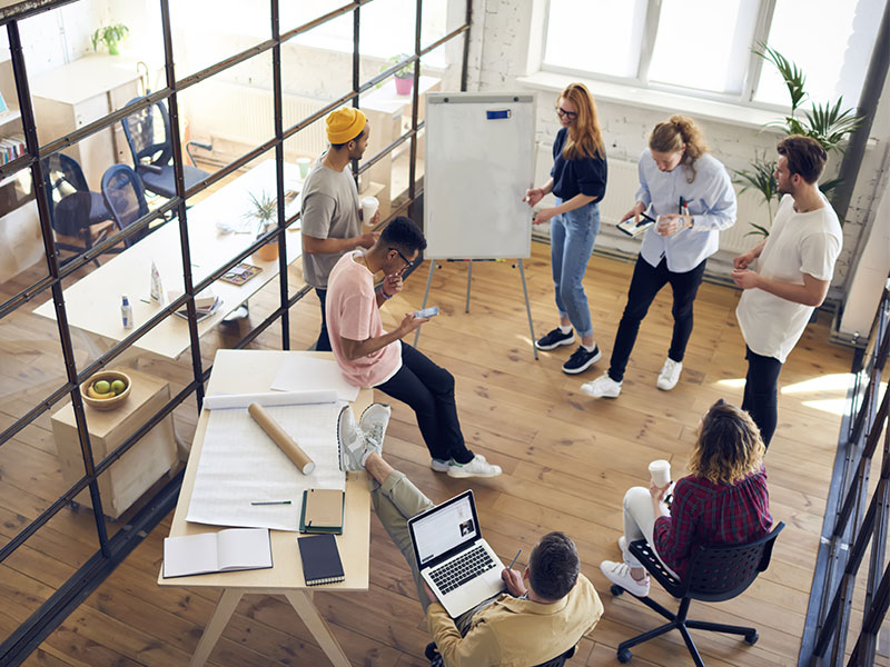 Aerial view of people having a meeting in a modern looking office