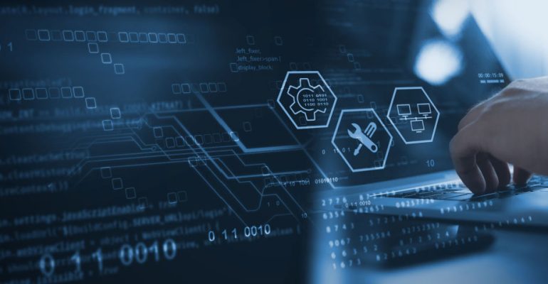 Hands typing on laptop with IT customer support icons displaying on the screen