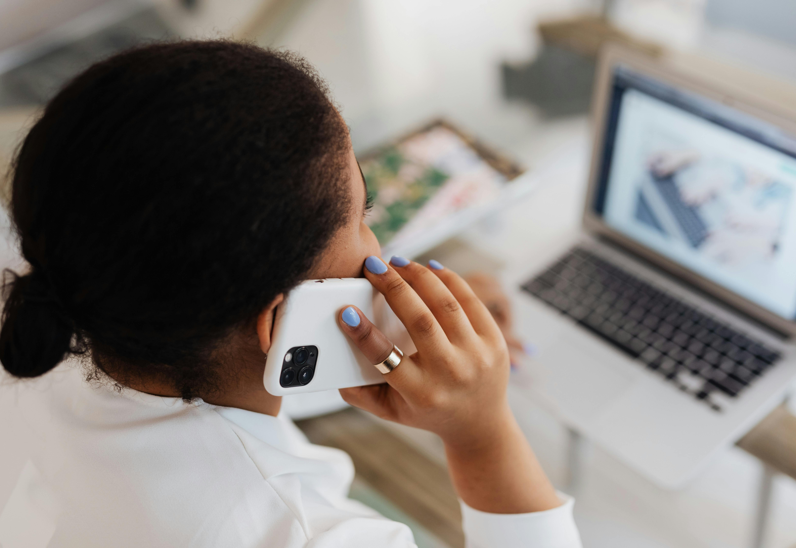 endpoint device protection Woman using multiple endpoint devices to complete business tasks.